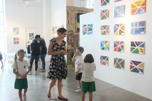 Parents, teachers and children enjoying the art exhibition. 