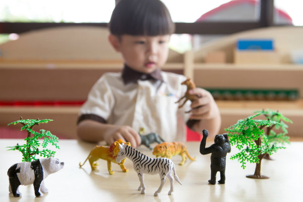 kid-with-toy-animals