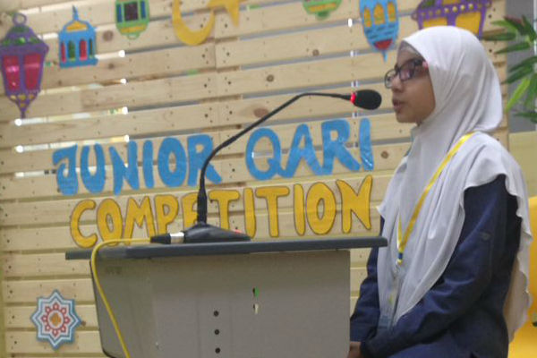 A participant confidently recites her part.
