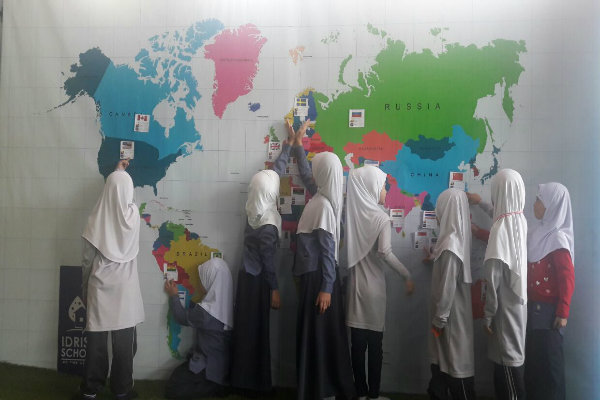 Idrissi Students Studying the Fasting World Map
