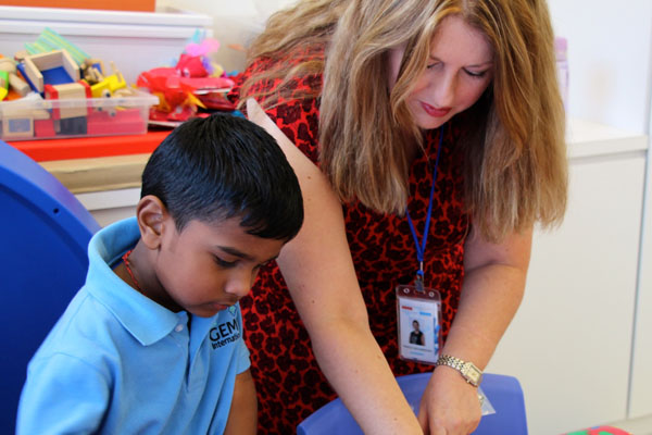 20151001214129_Woman_Teacher_and_boy_student_child_Kid_Playing_and_learning_in_GEMS_International_School_of_Pearl_City_in_Penang_2.jpg