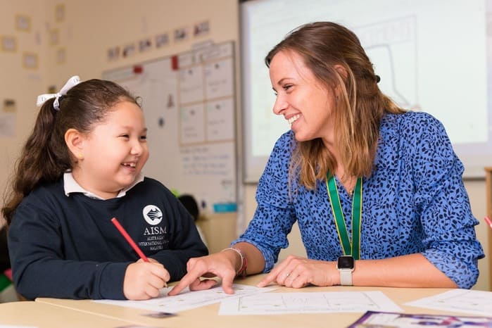 AISM Student with Teacher